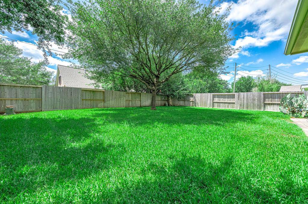 Enjoy the perfect shade under a beautiful tree in the backyard!