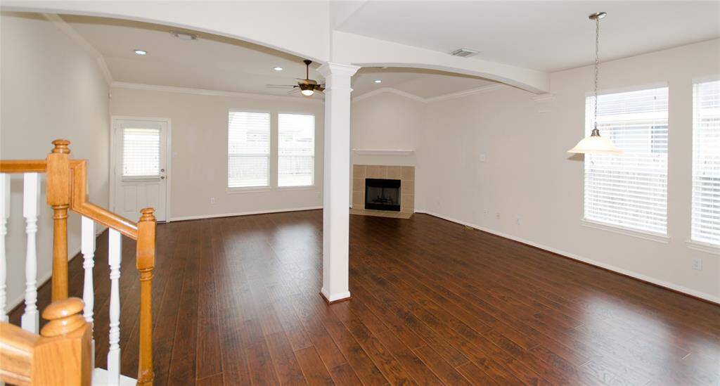 Very spacious and bright living room. The ceiling on the livingroom is raised with crown molding all around. There are connections in the wall to allow for mounting a TV for a very clean look.
