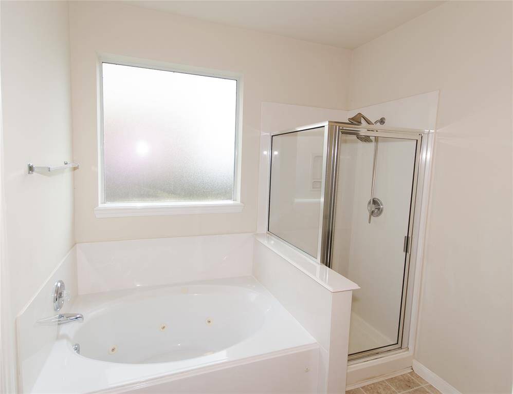Jacuzzi tub and Separate shower.