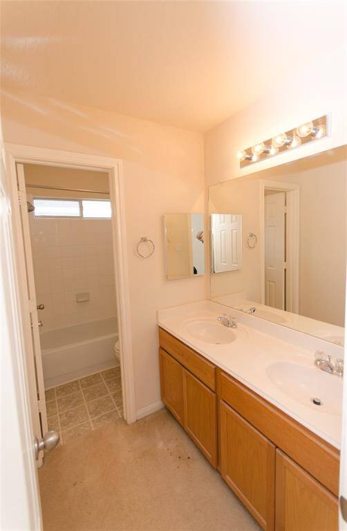 Full Bath upstairs that is next to the game room and Bedroom #2. Separate shower area.