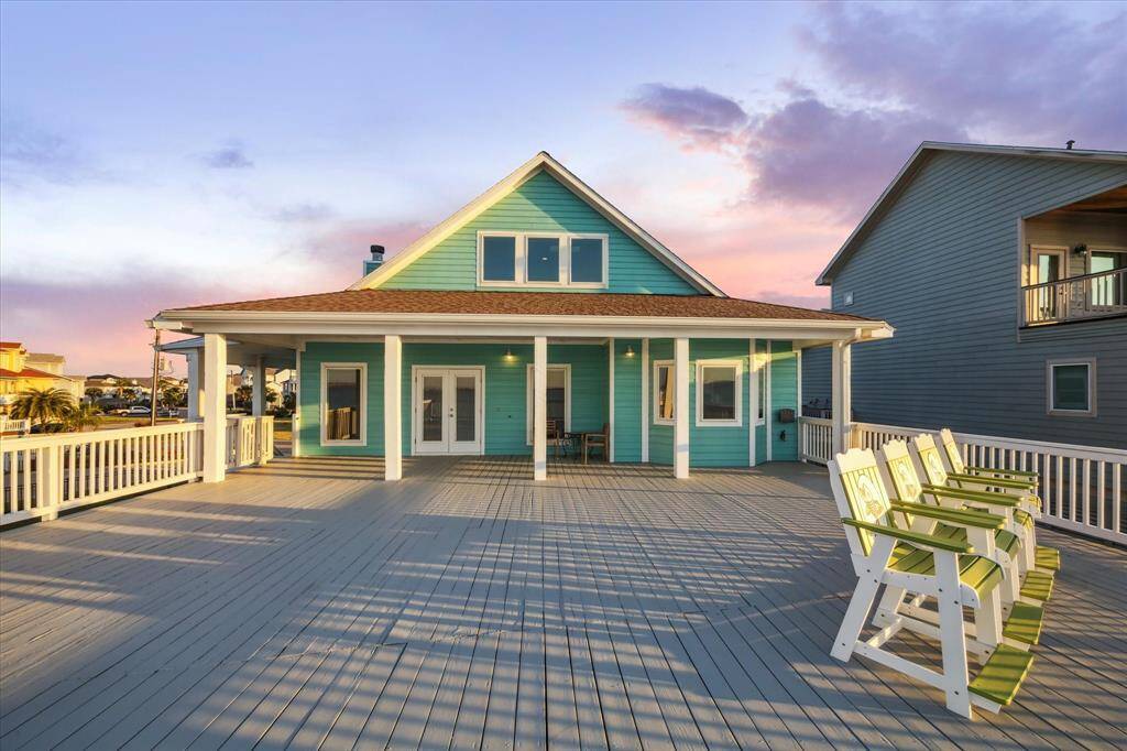 waterside of home showing off the large covered patio