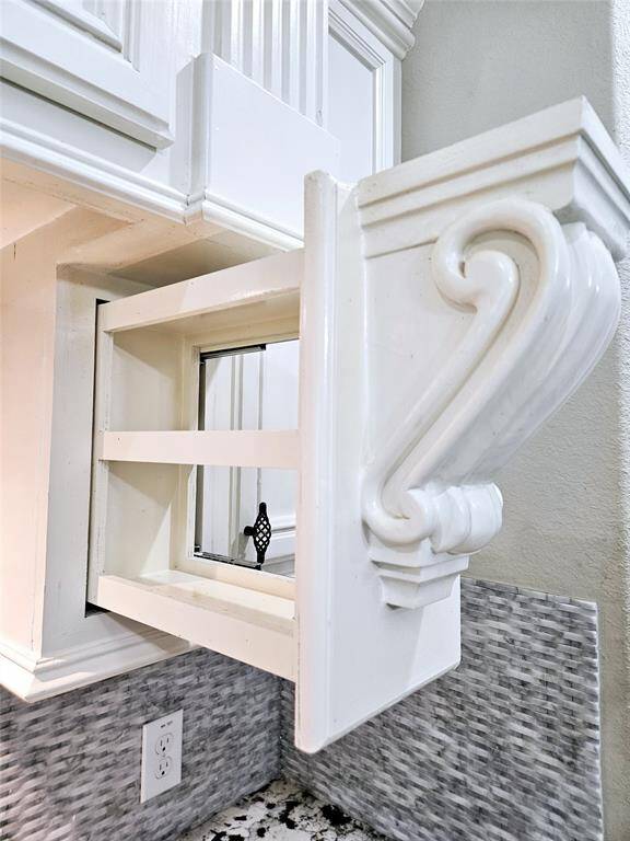 A little surprise is hidden on each side of the stove.  These spice racks make cooking easy for storing the spices within reach.