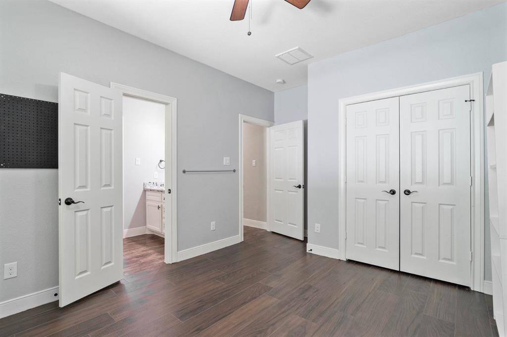 Bedroom #4 with a view of the jack and jill bathroom and closet.