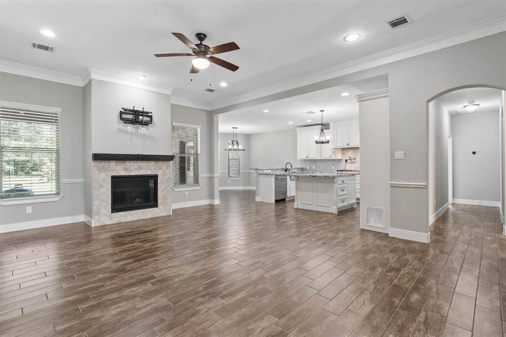 Massive living room that is open to the kitchen and breakfast nook. Plenty of room to host family and friends. The hallway leads to the formal dining, laundry, garage and primary bedroom.