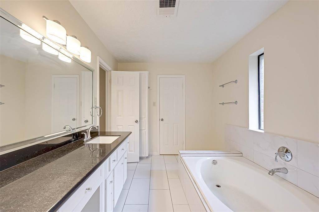 master bath with soaking tub