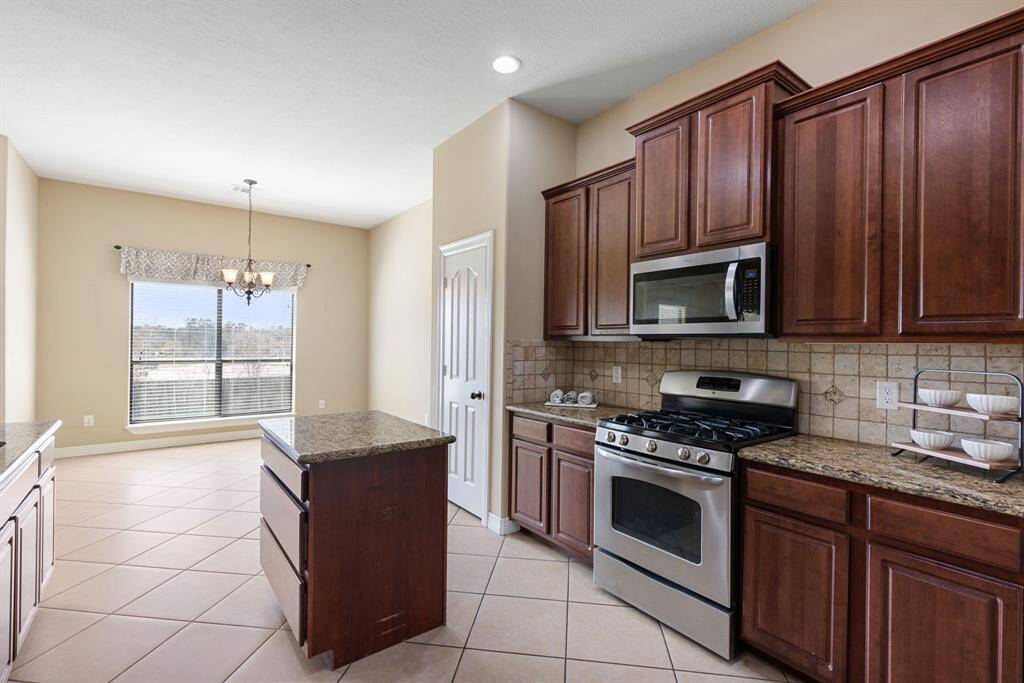 Storage in the island as well as full sized pantry. Gas oven/stovetop. Large dining space with oversized windows.