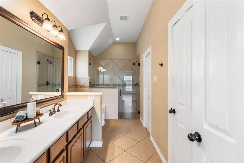 Double basins with large storage, oversized tub and separate shower. The walk in closet is huge.