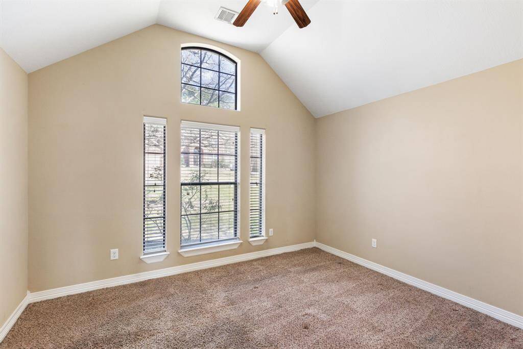 Bedroom #2 is located at the front with high ceilings and tons of light.