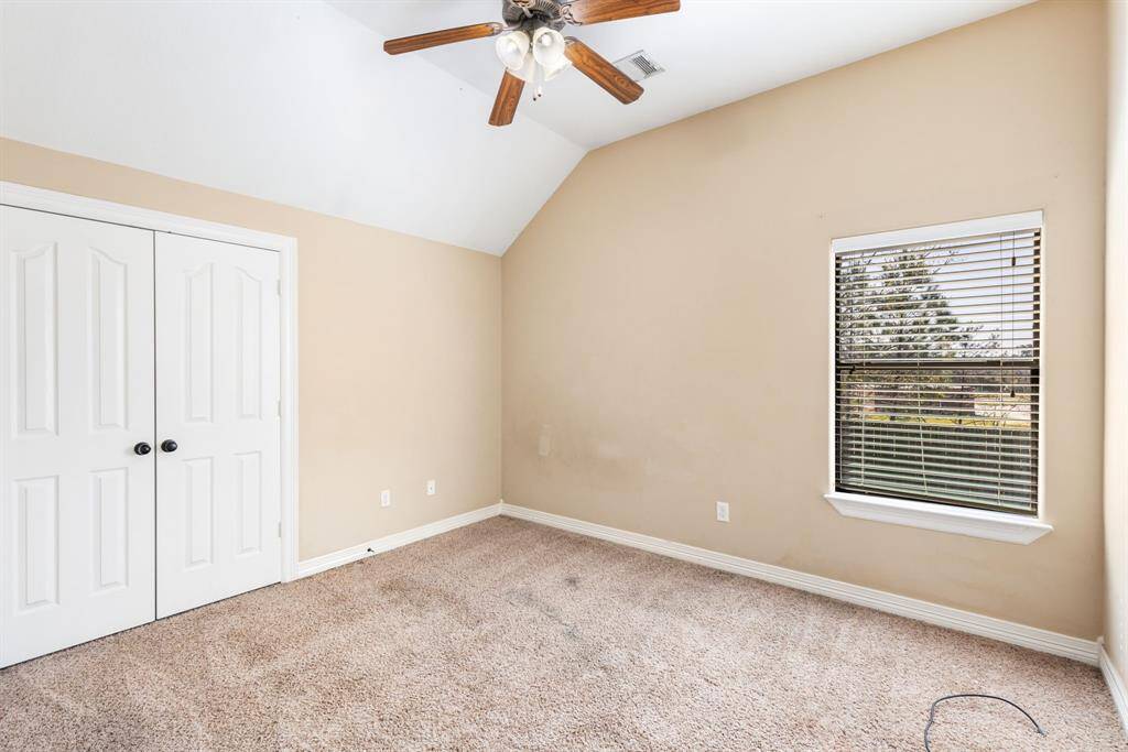 Bedroom #4 is located at the back with tons of light and oversized closet as well as high ceilings.