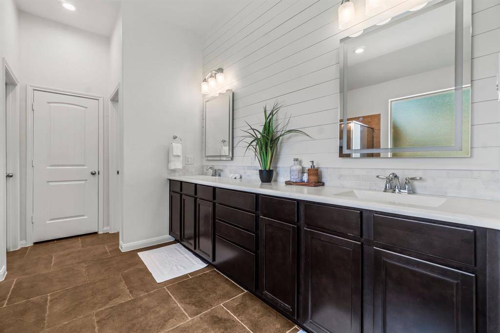 Double sinks with shiplap detail to match the master bedroom