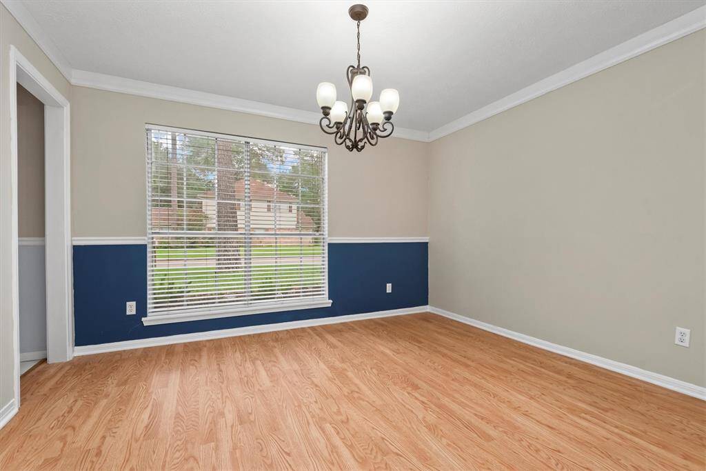 Another view of the formal dining space with plenty of natural light overlooking the front yard.