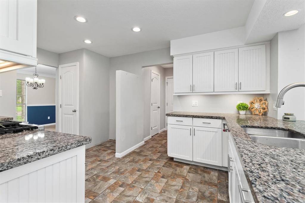 Here is another view of the well laid-out kitchen. You can see the the custom space for the refrigerator. The door to the left of this houses a convenient butler pantry.