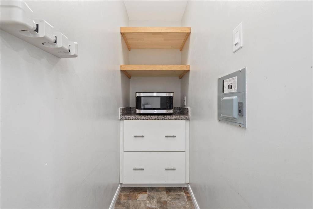 This functional and stylish butler’s pantry is located off the kitchen and dining area, ideal for additional storage.