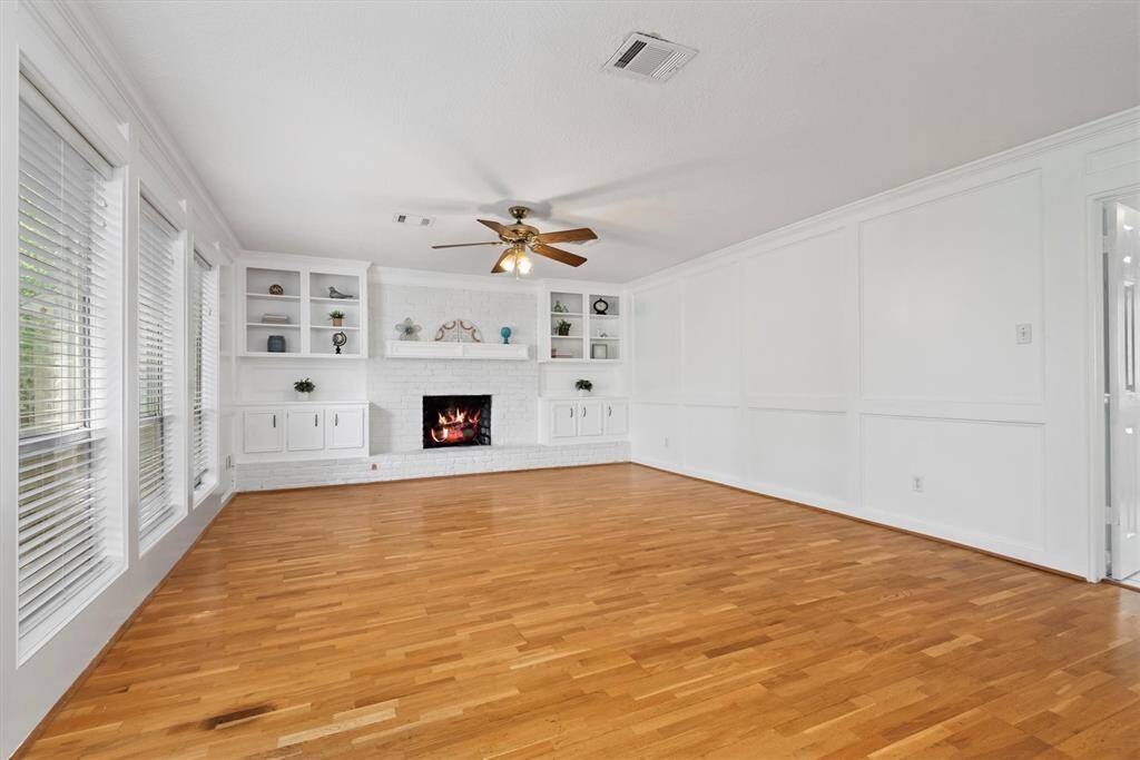 Enjoy the cozy gas log fireplace and built in storage.