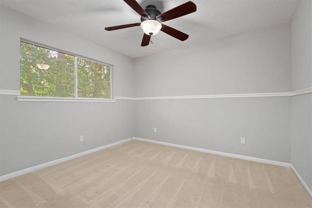 Comfortable secondary bedroom ideal for a guest room, nursery, or office.