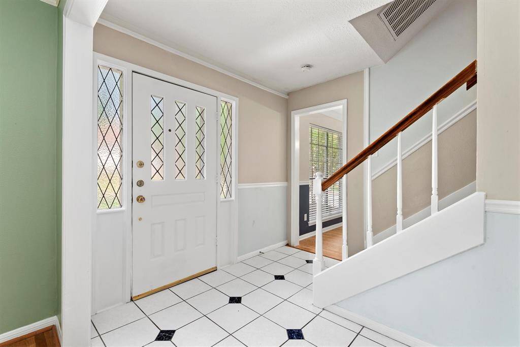 The welcoming entryway sets the tone for the charm found throughout the home.