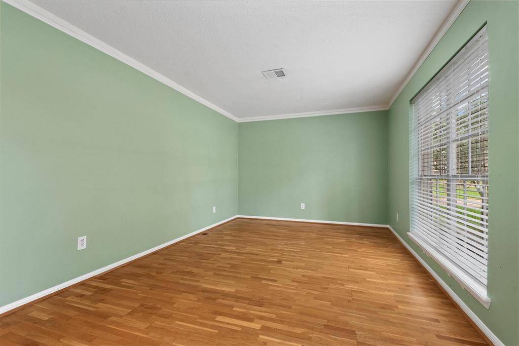 This cheerful room overlooks the beautiful front lawn.
