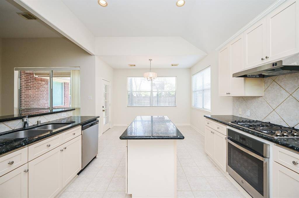 Kitchen with recent stainless steel appliances