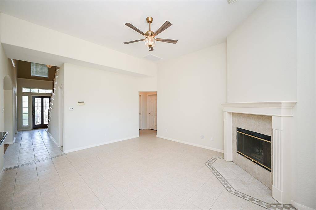 Family room with fireplace and open to the kitchen and breakfast area.