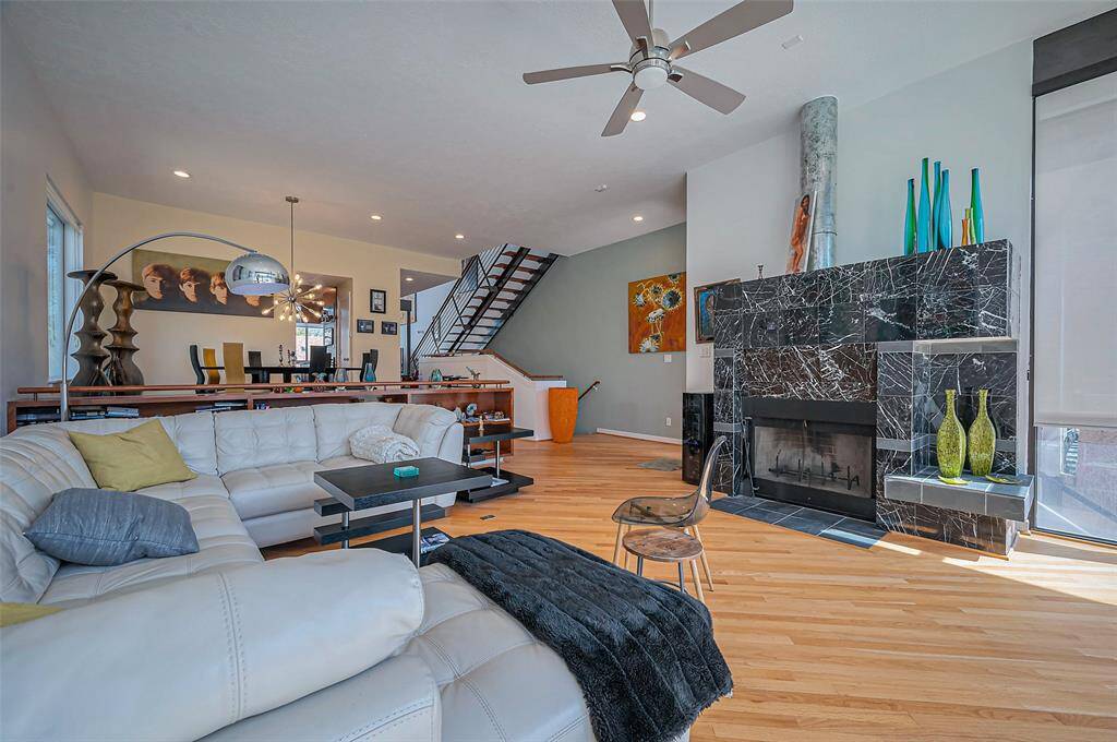 Step into a remarkably spacious living area that boasts impressive 24-foot ceilings, creating an inviting and airy atmosphere that’s perfect for relaxation.