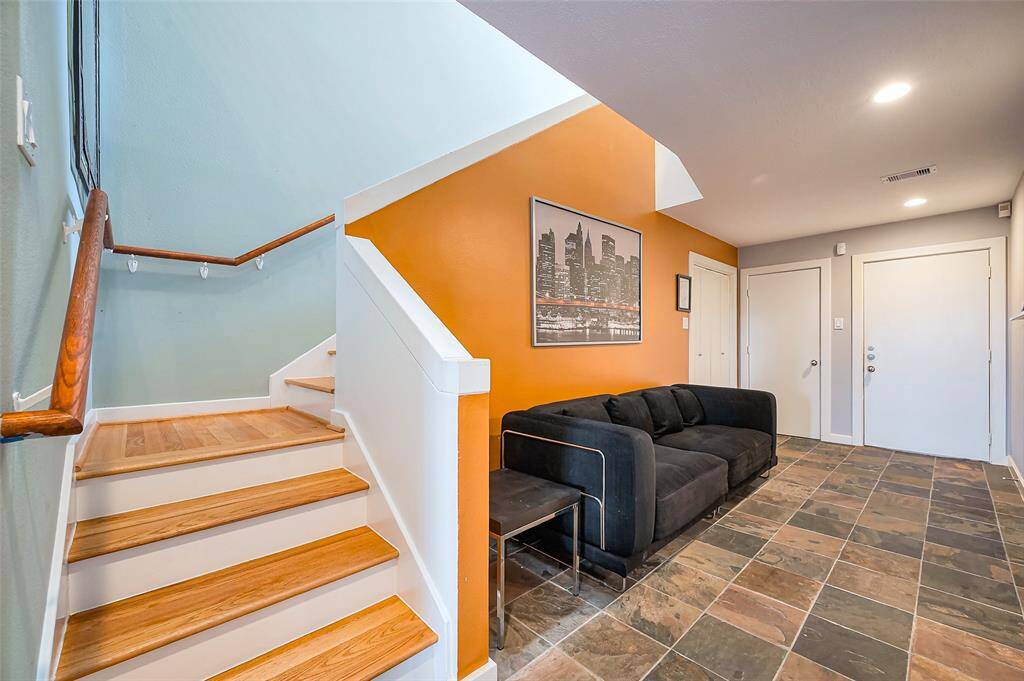The secondary bedroom is being used as a guest room with access to the backyard.