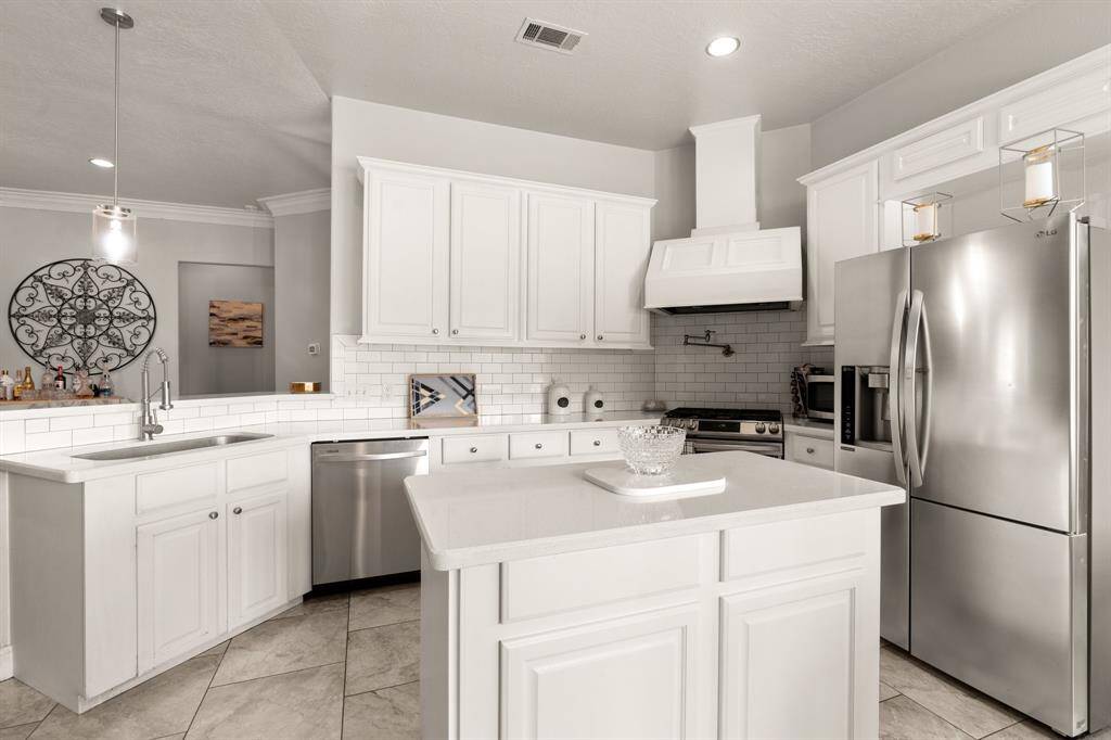 The refrigerator stays with the home. Great set up for a kitchen. What is for light and bright area to bake.