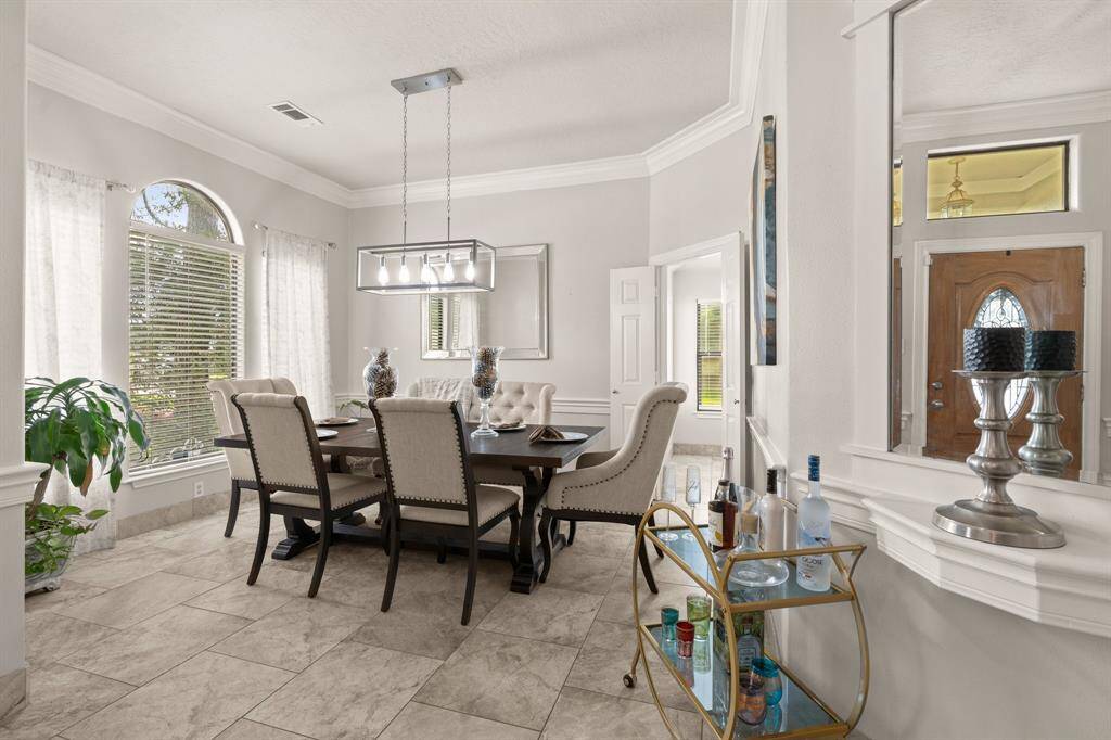 The formal dining room with access to kitchen and formal living room.