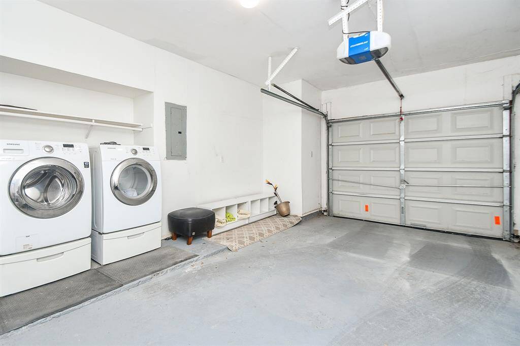 One car garage with washer and dryer.