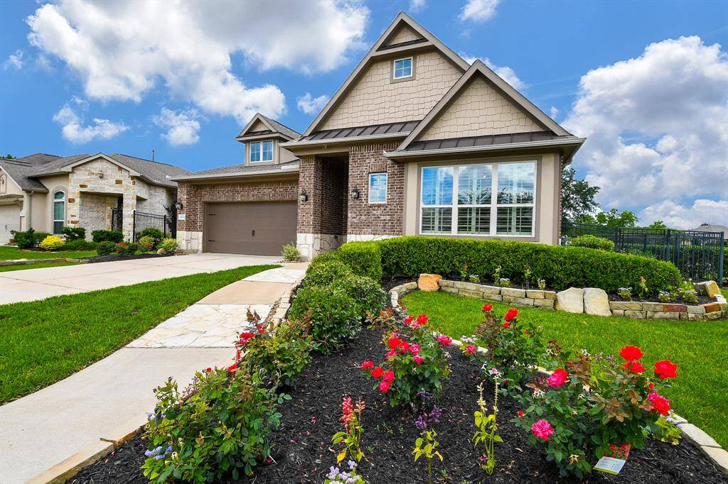 What's not to love, even at first sight? This exquisite, single story, brick/stone treasure is located at 18611 Benton Creek Lane, Cypress, TX, in the Wildwood at Northpointe gated community.
