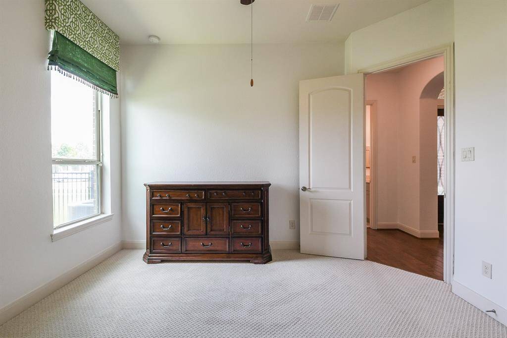Bright natural light fills this secondary carpeted bedroom; any of which may be used specifically as a nursery? hobby room? work out space? You have so many choices.