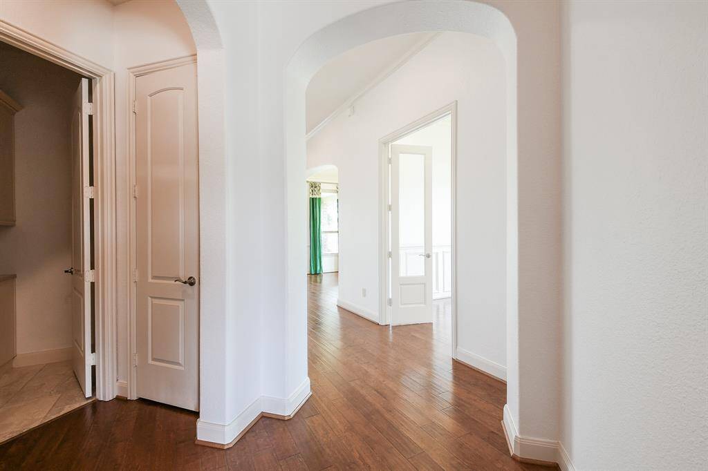 Walking through the main hallway delivers you to the open, airy placement of rooms, along the way.