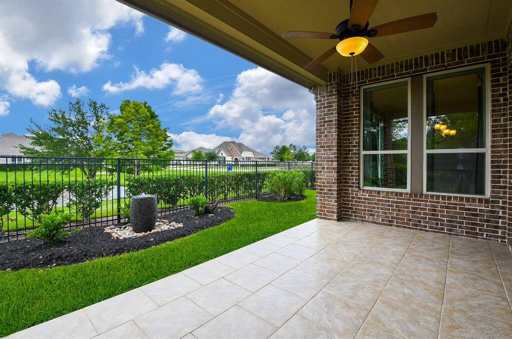 This is the scene from your covered patio; with gorgeous greenery, blue sunny skies, and a lakefront view, all your own!