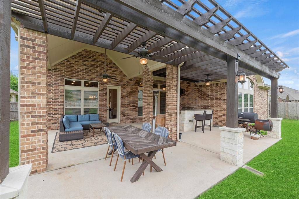 Beautiful outdoor living with custom stone kitchen