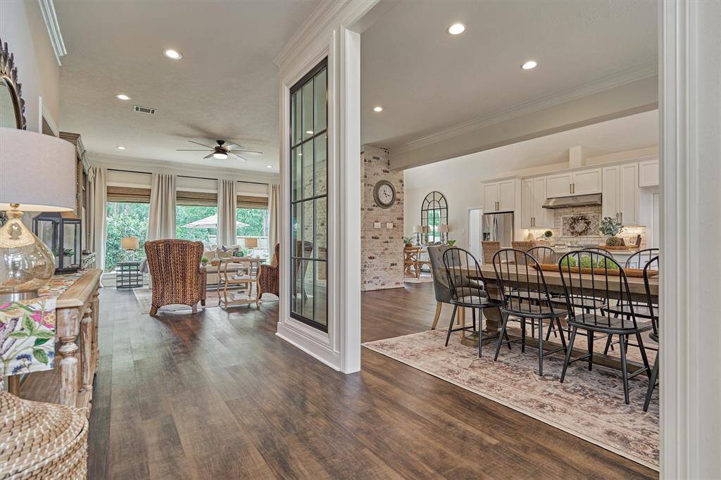 Entry to open-concept living and dining areas. Perfect space for family gatherings and entertaining.