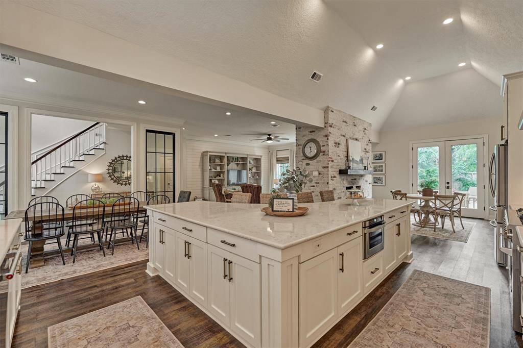 Open-concept kitchen, dining, family & breakfast areas provide an inviting comfortable atmosphere.