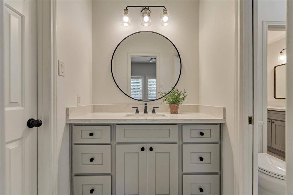 Hollywood bathroom with walk-in closet.