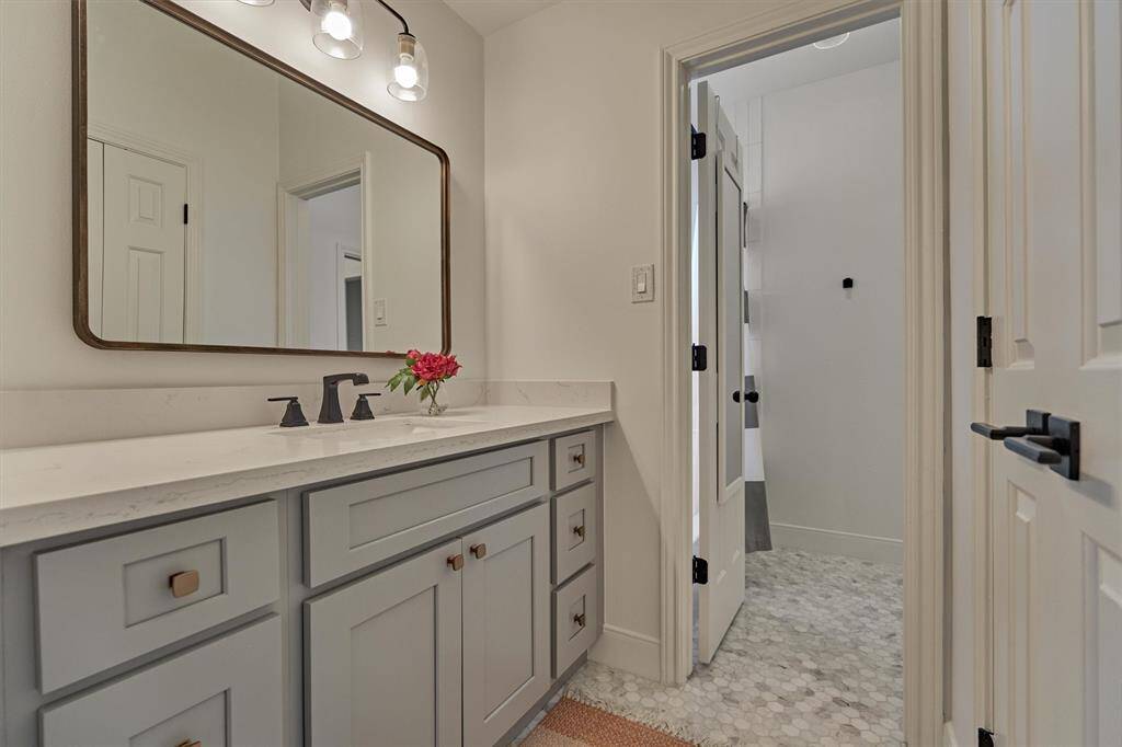Hollywood bathroom with walk-in closet.