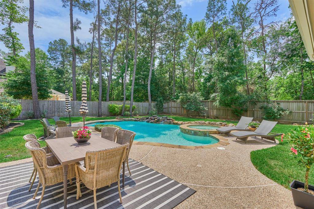 Sparkling pool & spa with patio space for dining and entertaining.