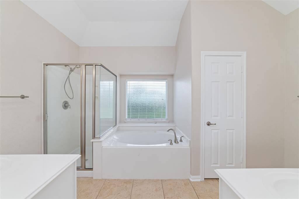 Primary bathroom with dual vanity sinks