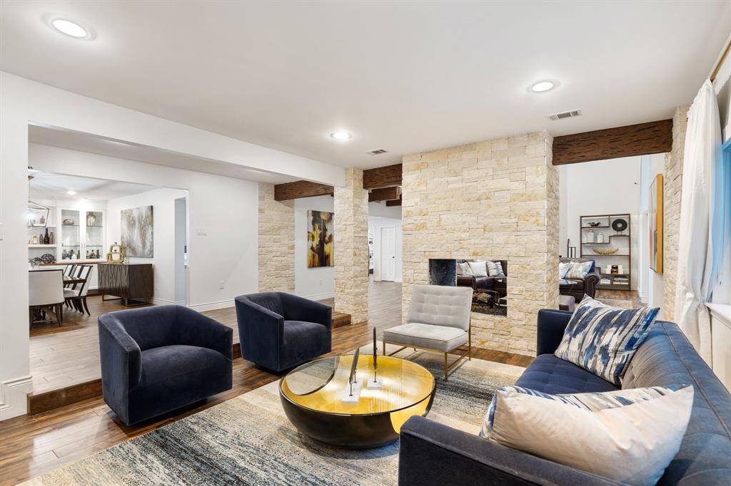 A view of the Living Room (17 x 14) through the Entry (14 x 7) to the Dining Room (20 x 13) shows how the first floor flows seamlessly through the casual and more formal living areas.  Great flow for entertaining or quiet times at home with family and friends.
