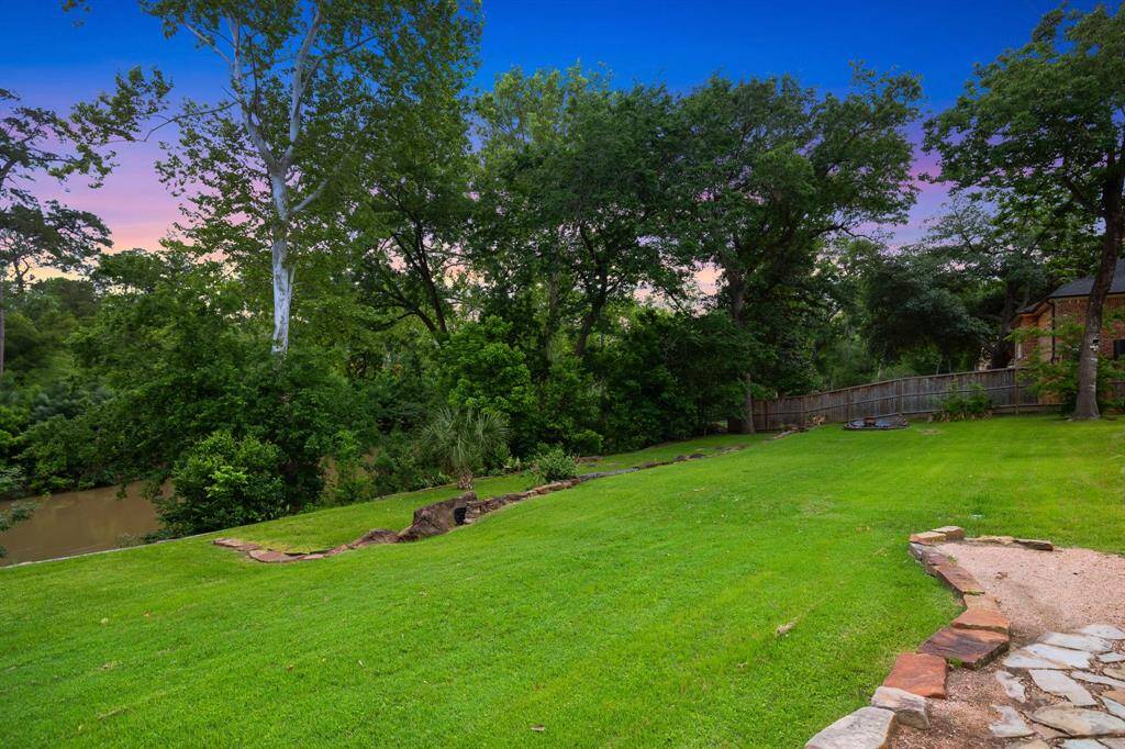 Gorgeous, terraced yard down to the bayou. Serene setting with plenty of room for pets, children and the young at heart.