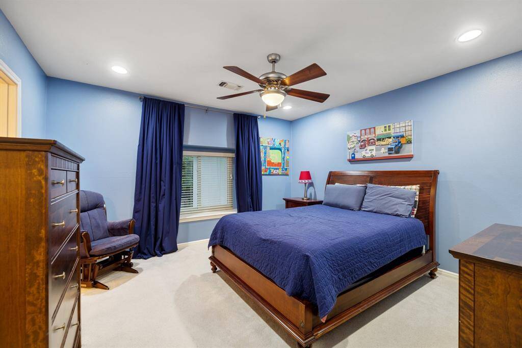 There are 2-secondary bedrooms that are connected by a Hollywood bath.  This Bedroom (13 x 13) is located on the front of the house and has a large walk-in closet.  Plenty of room for a queen sized bed, dresser (or 2) and a desk!