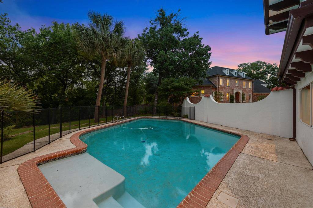 The sparkling swimming pool is just one of the many outstanding features of the amazing backyard on 36,250 SF LOT/HCD.