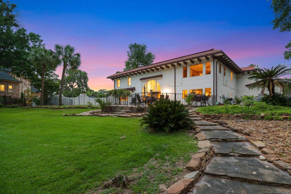 The walking stone path to the bayou from the upper level of the patio and swimming area.