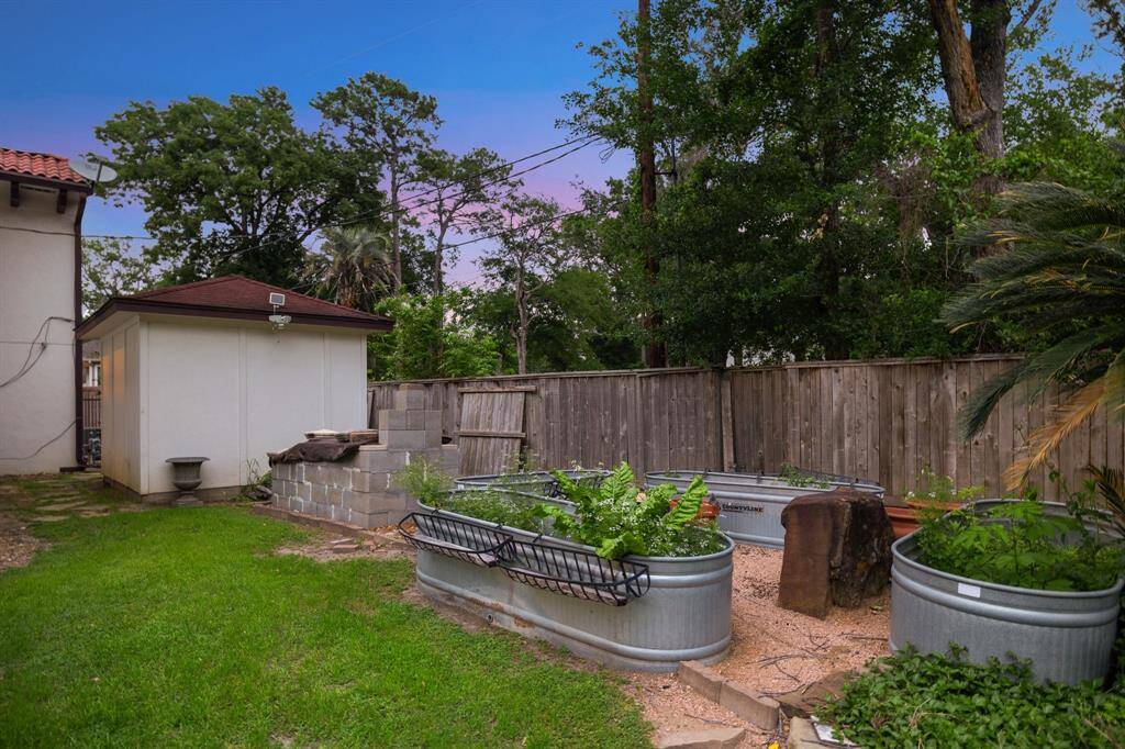 The herb and vegetable garden area and the built-in smoker are adjacent to the flagstone dining area (out of view).  There is truly something for everyone in this property.