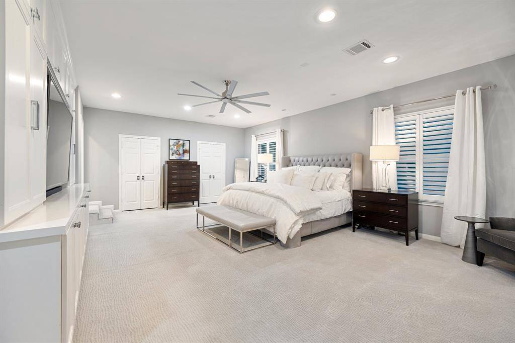Now THIS is a Primary Bedroom fit for royalty! Added upstairs in 2018, this lovely Primary Suite includes a study or sitting room (out of view with 2-closets) 2-reach in closets (closed doors) and a HUGE walk in closet (out of view). There is also a large built-in with upper and lower cabinets and room for a wall mounted TV. The spa inspired Primary Bath is at the end of the bedroom on the left (out of view).