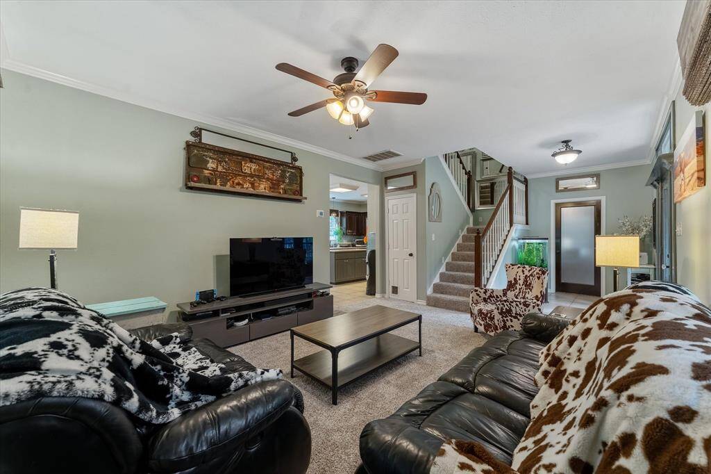 Abundant natural light in this living area. Interior repainted 2022