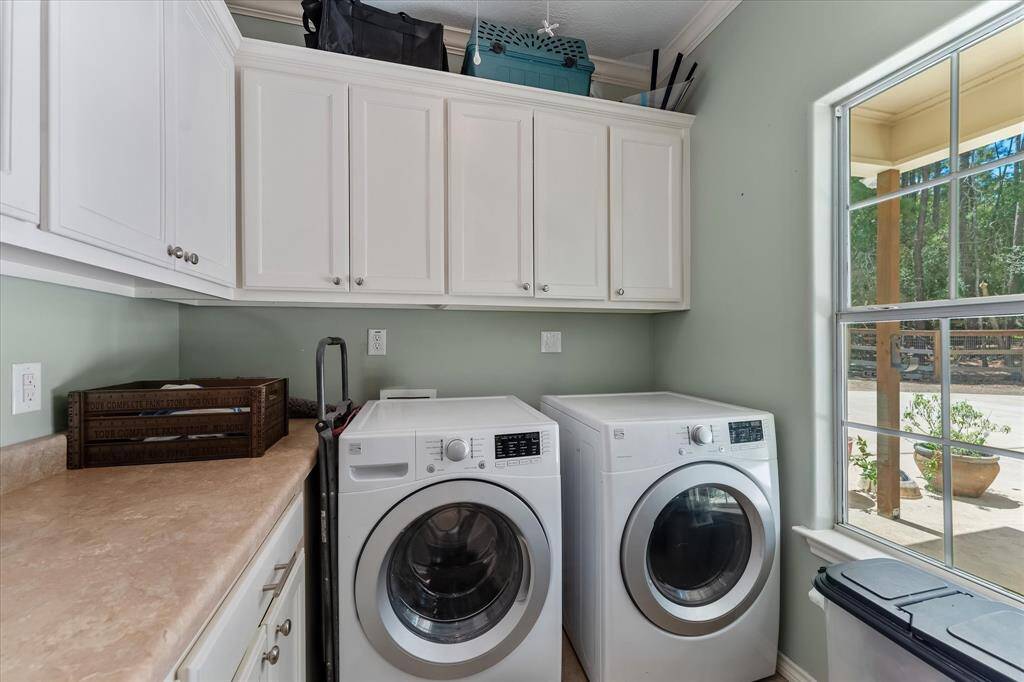Laundry room off the side entry with built-in storage, keeping the home tidy and organized.
