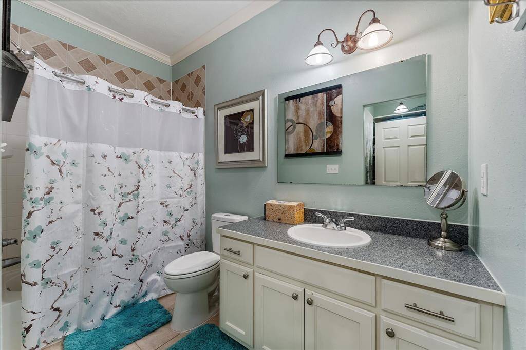 Full Bath located upstairs between secondary bedrooms. Updated fixtures and new toilet