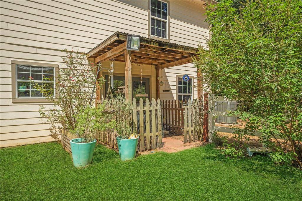 Covered patio leading to barn off kitchen and dining area.